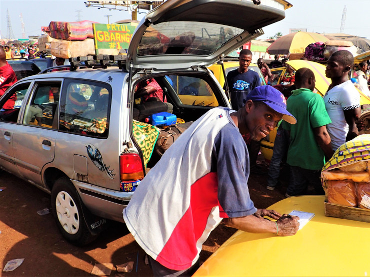 The world's coolest taxi driver, Tupee, in Monrovia, Liberia