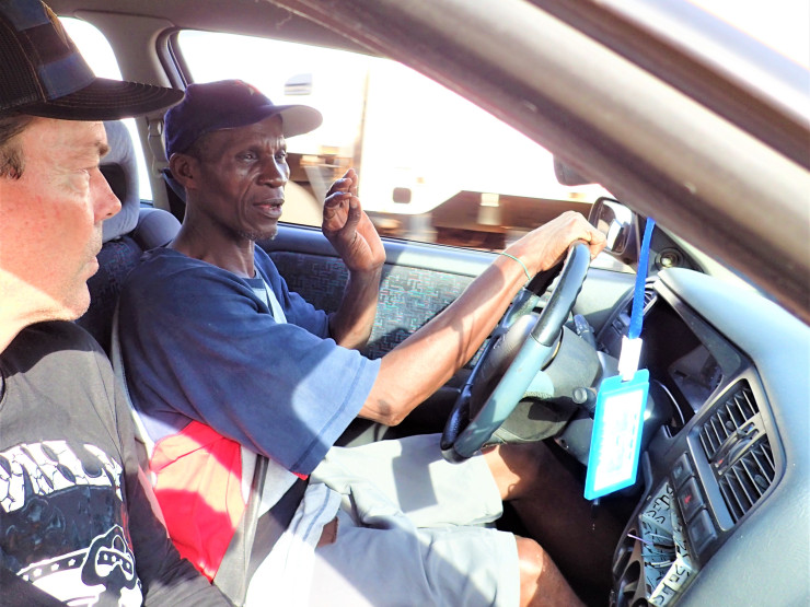 The world's coolest taxi driver, Tupee, in Monrovia, Liberia